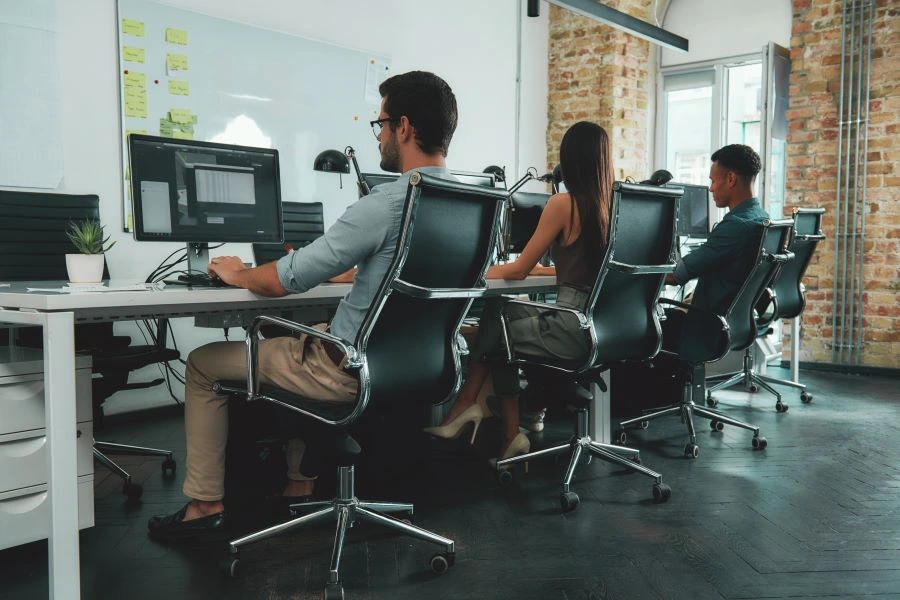 Employees sitting behind their computers